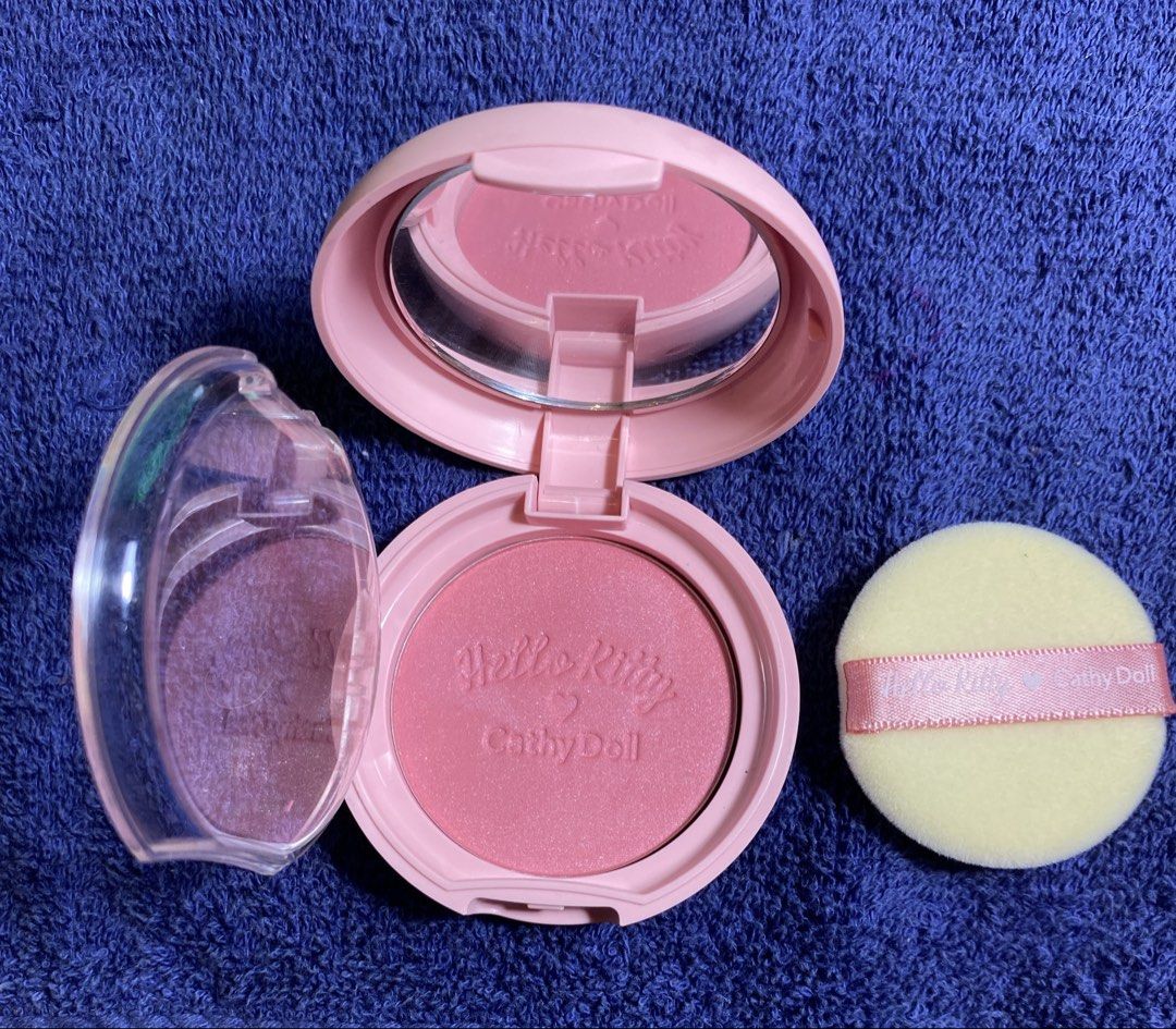 Hello Kitty Blusher #01 Frozen Strawberry (Category: Makeup) located in Muntinlupa City. Submitted by mj.finds (Listing ID 1462841387, Image 3). Description: - Cathy Doll x Kitty collaboration blusher - Shade: #01 Frozen Strawberry - Comes with applicator puff - Built-in mirror inside the compact - Adorable Kitty packaging, great for collectors - Adds a lovely pop of color to your cheeks.