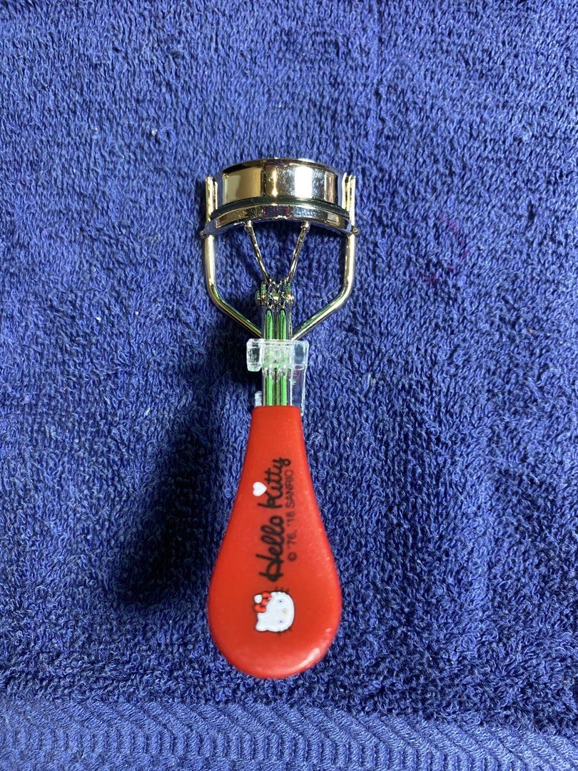 Hello Kitty Eyelash Curler Red (Category: Makeup) located in Muntinlupa City. Submitted by mj.finds (Listing ID 1462840800, Image 1). Description: Cute Kitty eyelash curler. Red handle with Kitty design. Metal curler part. Great for curling lashes. Easy to use. Perfect for your makeup bag..