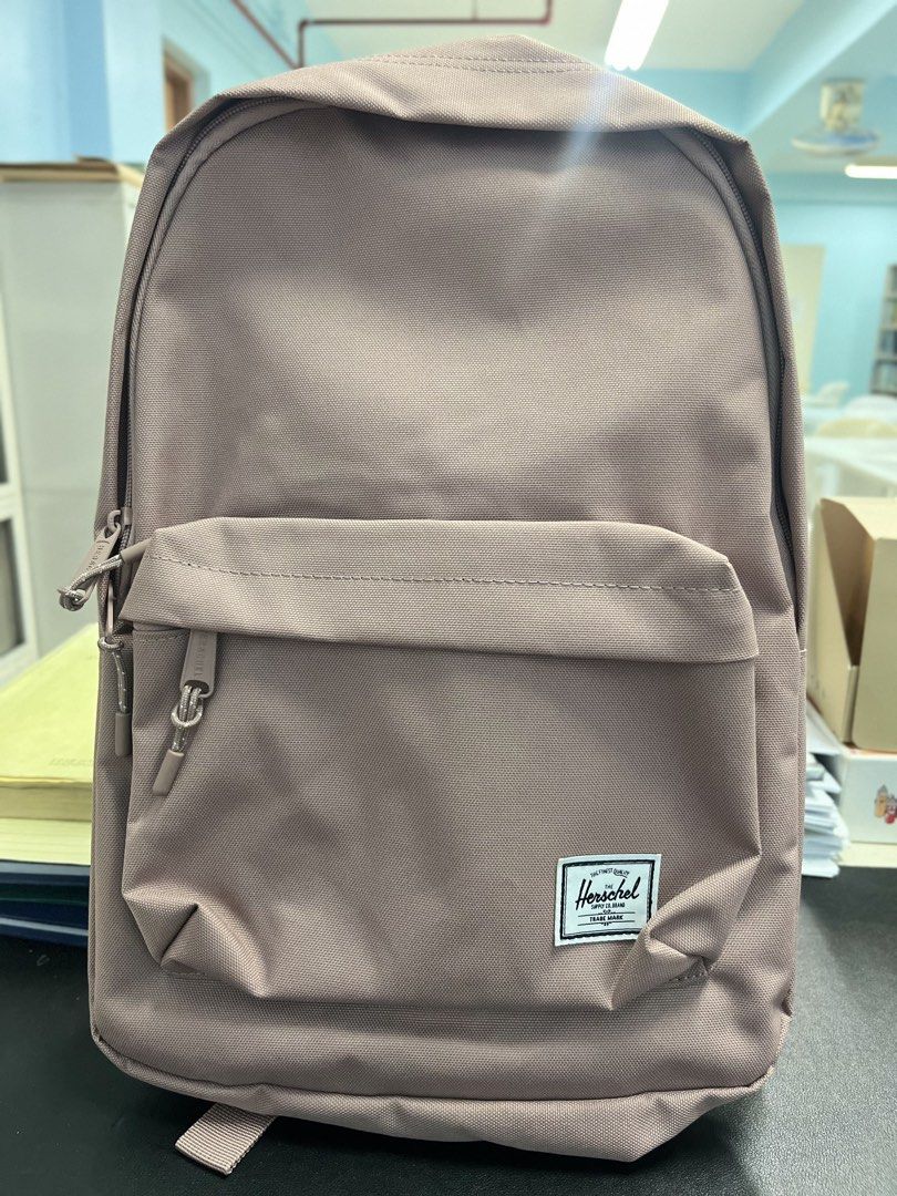 Herschel Classic Mid-Volume Backpack - Pinkish-Brown (Category: Backpacks) located in Caloocan City. Submitted by safewind.d918ef (Listing ID 1462709002, Image 1). Description: - Herschel Classic Mid-Volume backpack - Attractive pinkish-brown color - Front zip pocket for essentials - Spacious main compartment - Original tags still attached - Includes limited lifetime warranty - Ideal for school, work, or everyday adventures.