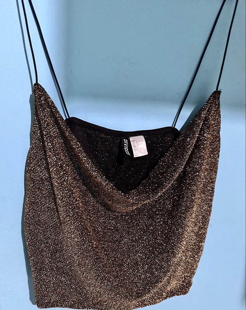 H&M Divided spagetti straps crop top (Category: Sleeveless) located in Cavite. Submitted by chicfinds.slay (Listing ID 1462810077, Image 2). Description: ✨gold shimmery cowl-neck crop top from H&M Divided featuring thin spaghetti straps and a sparkling metallic finish. ✨can fit up to 2xl Stretchable ✨no flaws .