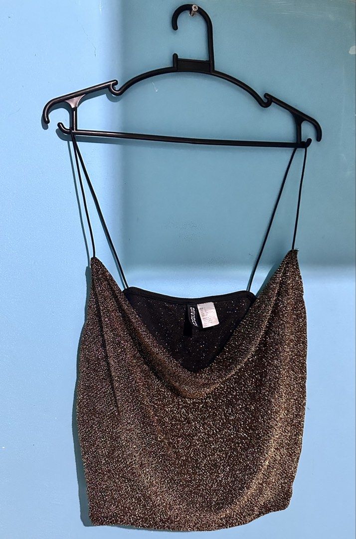 H&M Divided spagetti straps crop top (Category: Sleeveless) located in Cavite. Submitted by chicfinds.slay (Listing ID 1462810077, Image 1). Description: ✨gold shimmery cowl-neck crop top from H&M Divided featuring thin spaghetti straps and a sparkling metallic finish. ✨can fit up to 2xl Stretchable ✨no flaws .