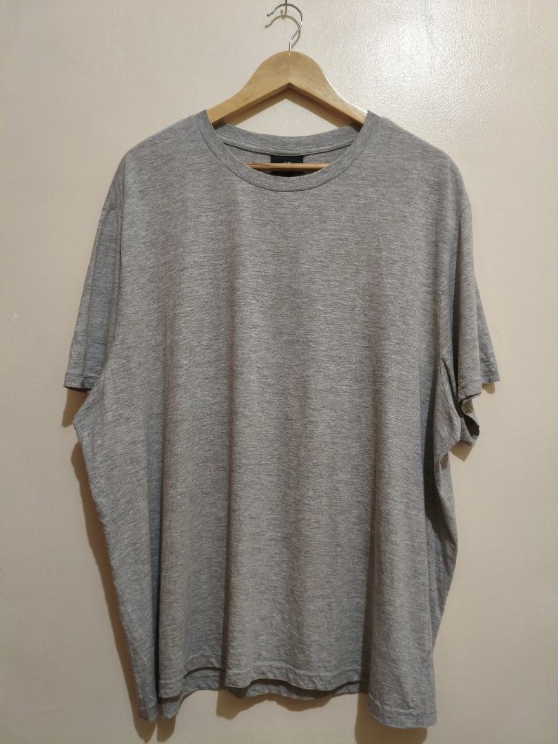 H&M Gray Cotton Shirt (Category: Tshirts & Polo Shirts ) located in Mandaluyong City. Submitted by frivsthriftsph (Listing ID 1462769417, Image 1). Description: H&M Gray Cotton Shirt Size XXL on tag. Actual dimes are 26W by 30L. Lightly used condition. Color rate is 10/10. No issue..