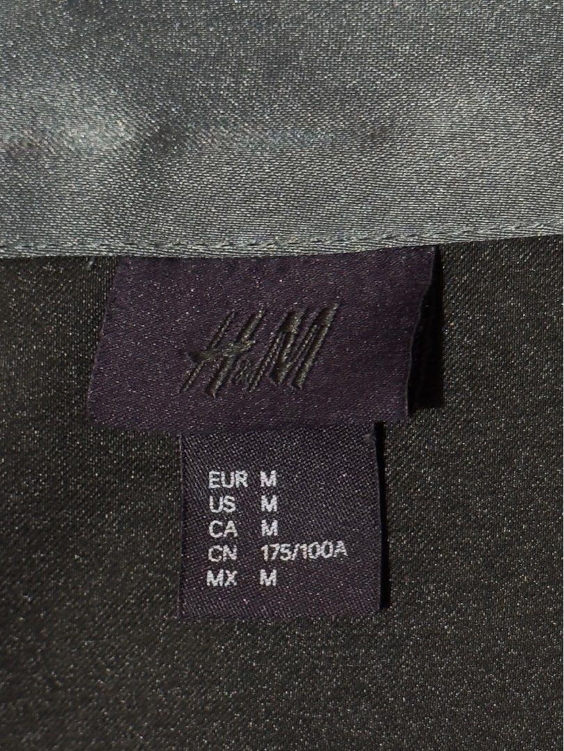 H&M Teal Satin Bomber Jacket (Category: Coats, Jackets and Outerwear) located in Muntinlupa City. Submitted by outmyspace1997 (Listing ID 1462881760, Image 3). Description: - Grey satin bomber jacket from H&M - Size: Medium (M) but can fit up to Large (L) - Features a zip-up front - Two convenient side pockets - Elasticated hem and cuffs for a comfortable fit - Ideal for layering over outfits.