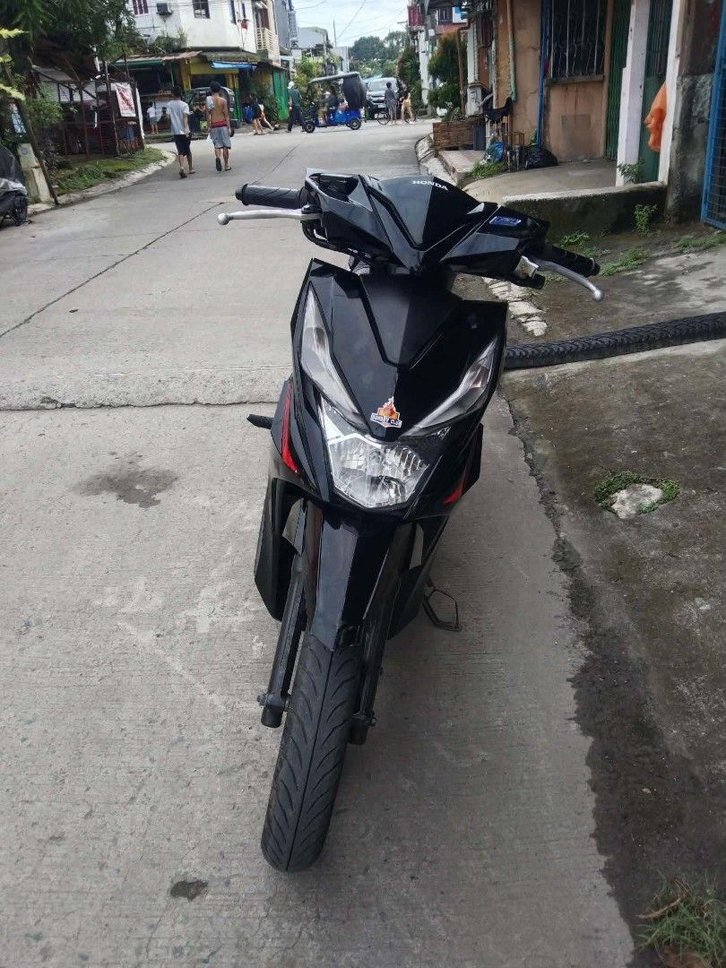 Honda Beat Fi Scooter - Black (Category: Motorbikes for Sale) located in Manila. Submitted by applellame37298 (Listing ID 1462701411, Image 2). Description: Selling my Honda Beat Fi scooter. It's black with red accents. The odometer shows 30415 km. Tires have custom decals. Ready for a new owner. Message me for details. negotiable price.