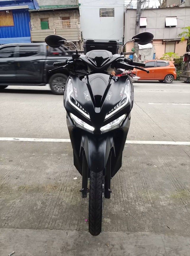 Honda Click 125i Matte Black with Top Box (Category: Motorbikes for Sale) located in Carmona. Submitted by wildtree-bff2 (Listing ID 1462814910, Image 3). Description: Matte black Honda Click 125i. Comes with a large top box for extra storage. White rims add a nice contrast. Seat has a custom pattern. Ready for your daily rides or deliveries. Well-maintained and runs smoothly. Great for city commuting..