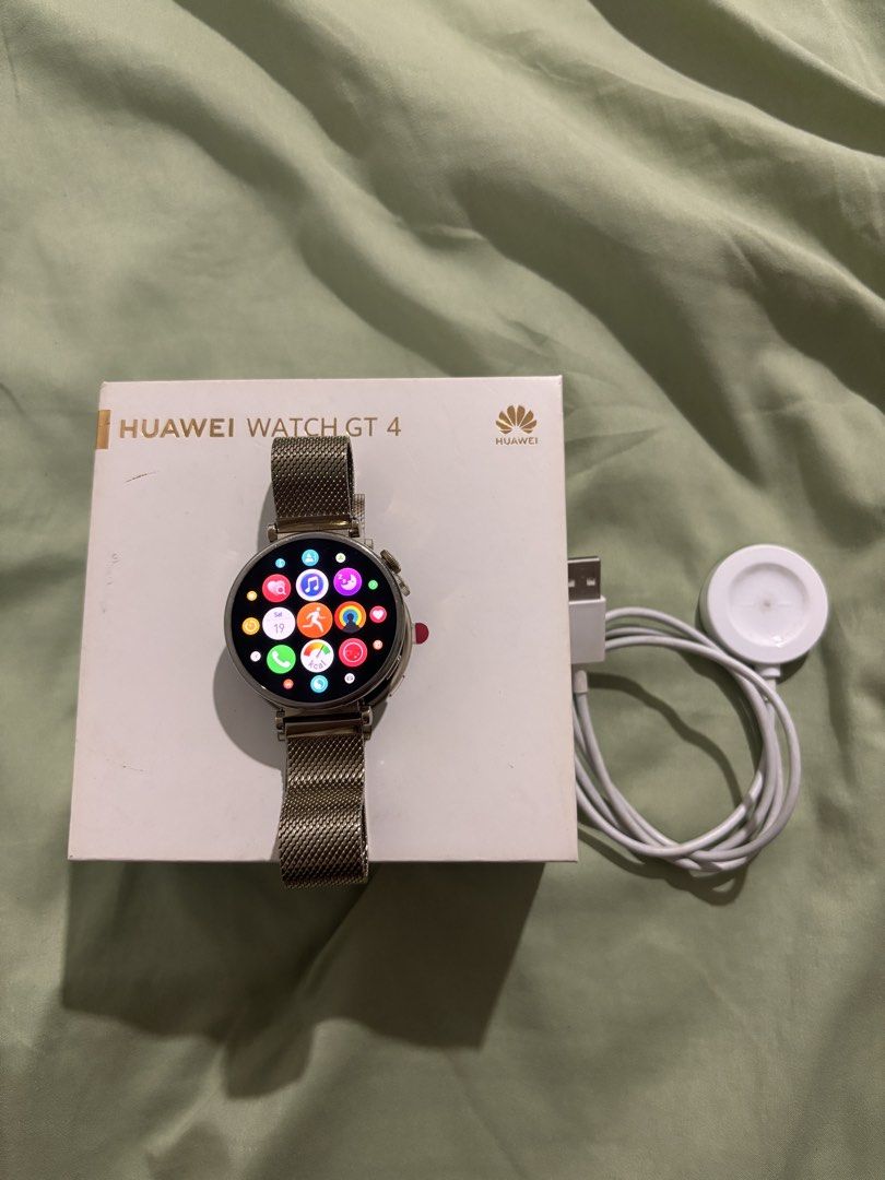 Huawei Watch GT 4 with Gold Strap (Category: Wearables & Smart Watches) located in Pasig City. Submitted by tealmnl (Listing ID 1462744218, Image 1). Description: In good condition. No issue. Inclusion: Box Magnetic Charger RFS: Plan to upgrade.