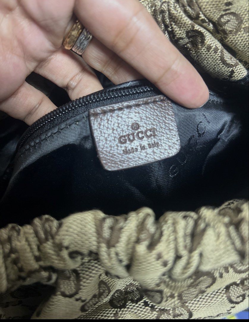 Inspired Gucci Monogram Canvas Drawstring Shoulder Bag (Category: Luxury Bags & Wallets) located in General Trias. Submitted by mybag2025 (Listing ID 1462851201, Image 2). Description: - Gucci shoulder bag coded - Classic GG monogram canvas - Brown leather trim and straps - Drawstring closure - Interior pocket - Shows some signs of wear on leather and canvas.