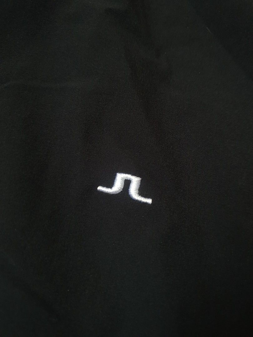 Authentic j.lindeberg golf track jacket / windbreak (Category: Coats, Jackets and Outerwear) located in Makati City. Submitted by nvdluxurygoods (Listing ID 1462804417, Image 2). Description: no flaws, no issue Black J.Lindeberg golf track jacket / windbreak full-zip athletic jacket featuring a striking bright blue stripe down the right sleeve..