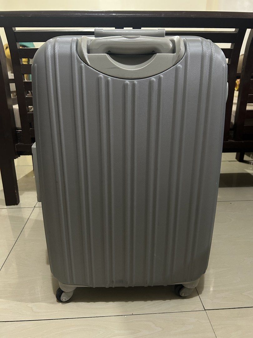 JETAGE Suitcase (Category: Luggage) located in Taguig. Submitted by ghiebow06 (Listing ID 1462758533, Image 3). Description: Dimensions: H- 26 W- 17 D- 10 1/2 - Grey hard shell suitcase - Built-in TSA lock with key for security - Retractable handle and smooth-rolling wheels for easy mobility - Ideal size for short trips or as a carry-on - Shows minor scuffs from normal use, but fully functional - Your reliable travel companion for your next adven