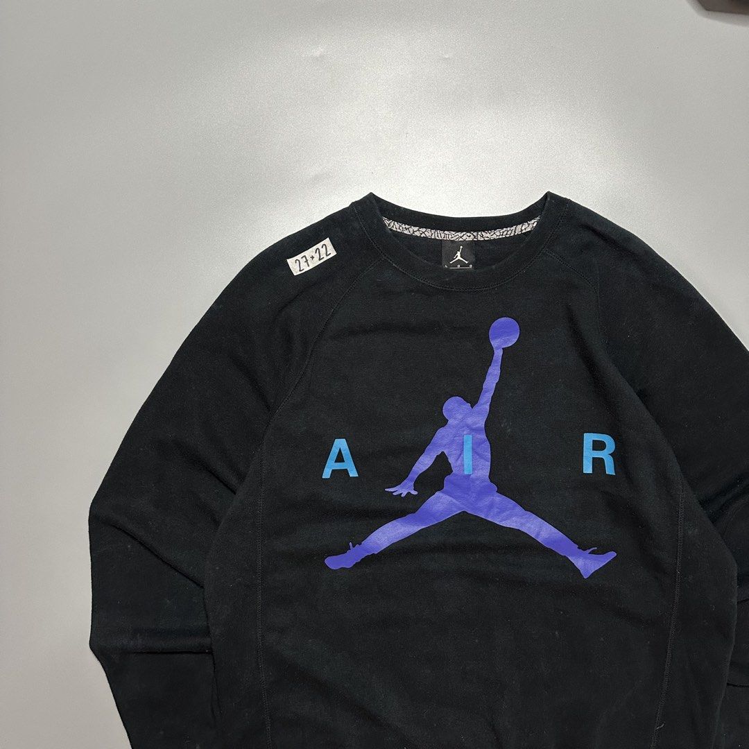 Jordan Pullover Sweatshirt (Category: Coats, Jackets and Outerwear) located in Baguio. Submitted by subaitems (Listing ID 1462780267, Image 2). Description: - Black Jordan sweatshirt - Iconic Jumpman logo with purple and blue gradient - 'AIR' text detail - Size: Large (L) - Made in China - Ideal for casual wear.