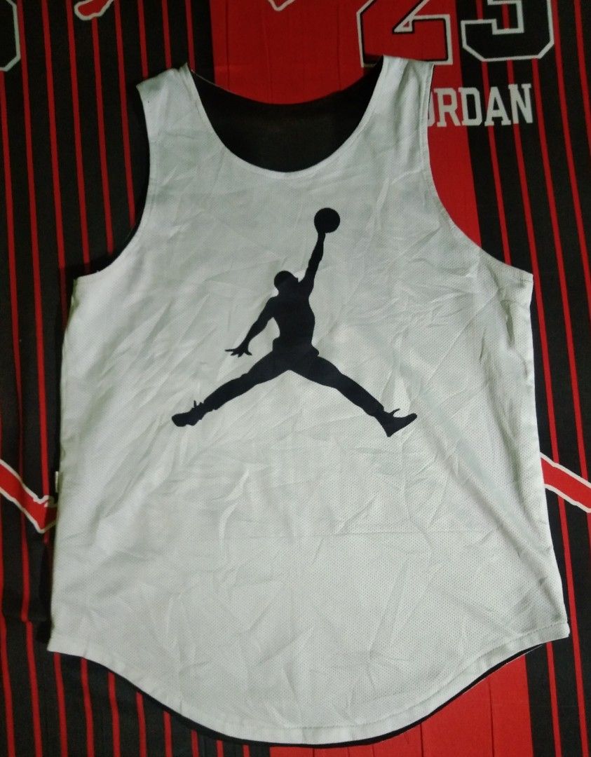 Jordan Reversible Basketball Jersey (Category: Activewear) located in Quezon City. Submitted by aljonbermu25659 (Listing ID 1462704132, Image 1). Description: - Reversible Jordan basketball jersey - Side 1: White with black Jumpman logo - Side 2: Black with white Jumpman logo - Material: 100% Polyester - Ideal for basketball or casual wear.