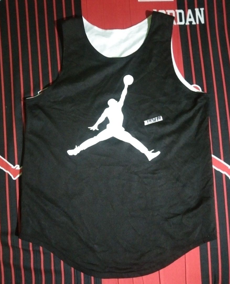 Jordan Reversible Basketball Jersey (Category: Activewear) located in Quezon City. Submitted by aljonbermu25659 (Listing ID 1462704132, Image 2). Description: - Reversible Jordan basketball jersey - Side 1: White with black Jumpman logo - Side 2: Black with white Jumpman logo - Material: 100% Polyester - Ideal for basketball or casual wear.
