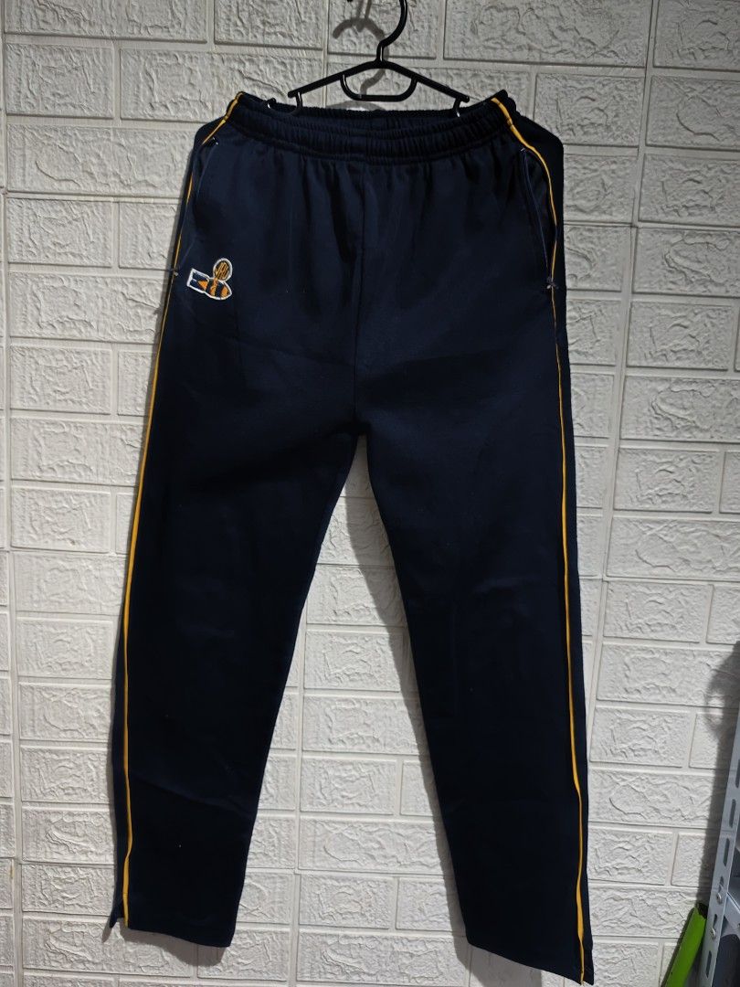 JRU jogging pants (Category: Other Bottoms) located in Pasay City. Submitted by clotheslinemanila (Listing ID 1462769385, Image 1). Description: - Navy blue track pants - Yellow stripes down the sides - Embroidered cute bee logo on the left leg - Elastic waistband with drawstring - Side pockets - Ideal for sports or casual wear.