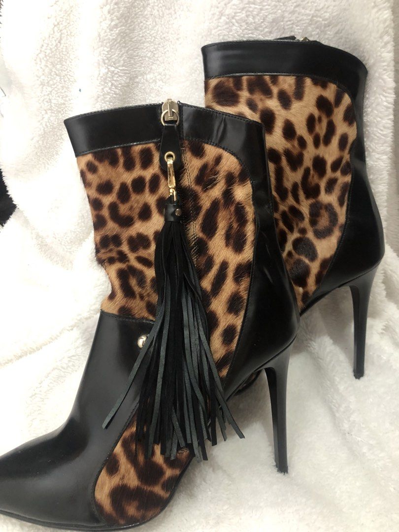 Just Cavalli Leopard Print Leather Ankle Boots (Category: Boots) located in Manila. Submitted by sharmaine.24 (Listing ID 1462710802, Image 3). Description: - Brand: Just Cavalli - Style: Ankle Boots - Color: Black with Leopard Print Calf Hair Panels - Features: Pointed Toe, Stiletto Heel, Side Zip Closure with Tassel Detail - Material: Leather and Calf Hair - Origin: Made in Italy - Size: 39 - Description: A bold statement piece to elevate any o