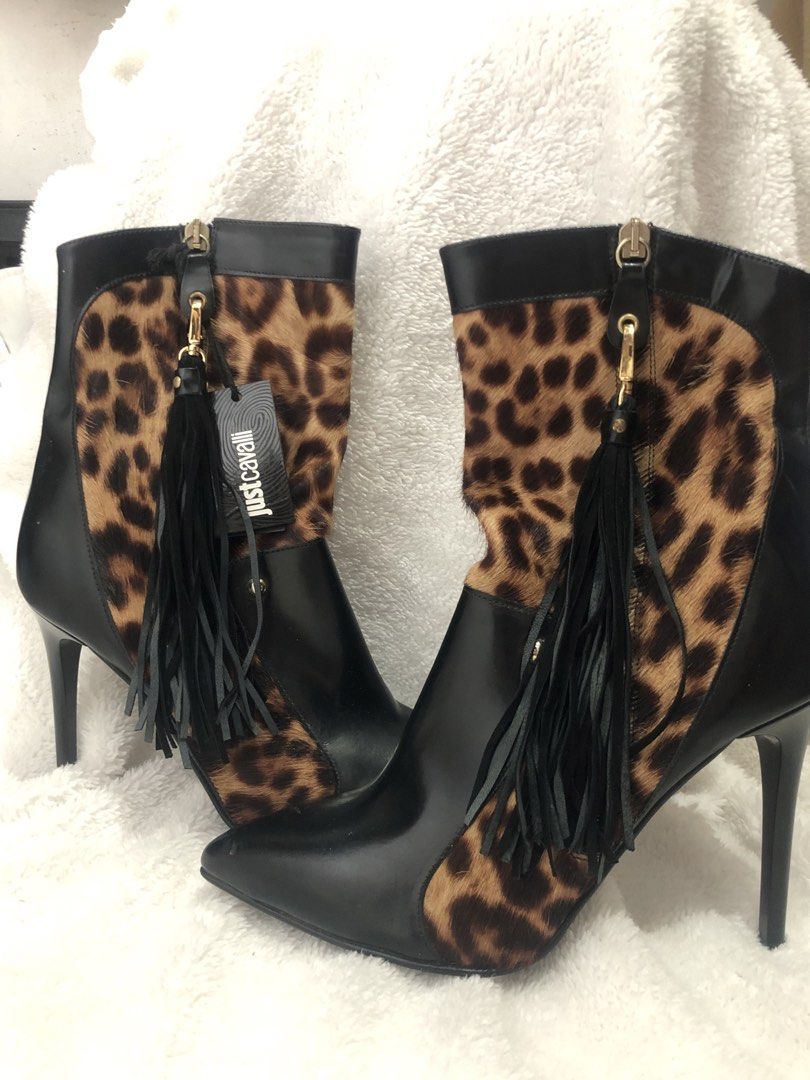 Just Cavalli Leopard Print Leather Ankle Boots (Category: Boots) located in Manila. Submitted by sharmaine.24 (Listing ID 1462710802, Image 1). Description: - Brand: Just Cavalli - Style: Ankle Boots - Color: Black with Leopard Print Calf Hair Panels - Features: Pointed Toe, Stiletto Heel, Side Zip Closure with Tassel Detail - Material: Leather and Calf Hair - Origin: Made in Italy - Size: 39 - Description: A bold statement piece to elevate any o