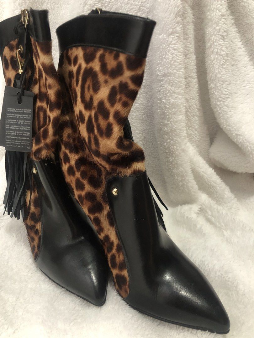 Just Cavalli Leopard Print Leather Ankle Boots (Category: Boots) located in Manila. Submitted by sharmaine.24 (Listing ID 1462710802, Image 2). Description: - Brand: Just Cavalli - Style: Ankle Boots - Color: Black with Leopard Print Calf Hair Panels - Features: Pointed Toe, Stiletto Heel, Side Zip Closure with Tassel Detail - Material: Leather and Calf Hair - Origin: Made in Italy - Size: 39 - Description: A bold statement piece to elevate any o