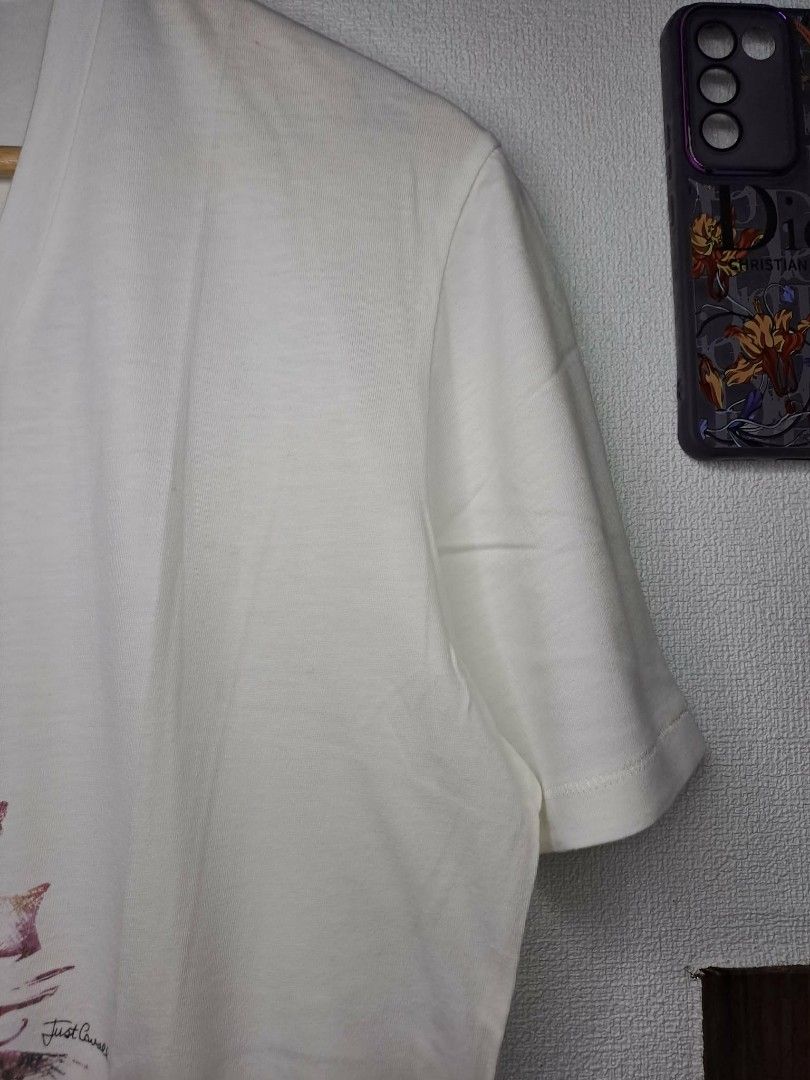Just Cavalli Long V - Neck (Category: Luxury Apparel) located in Quezon City. Submitted by yaseen73 (Listing ID 1462869879, Image 2). Description: Authentic Just Cavalli Long V - Neck Featuring Floral JC Interlocking Embroidered Logo Made in Moldova Cotton Fabric 100% Color : White & Camou Green Wearing Size : S on Tag Dimensions : Please Refer to the Photo Color Rate : 9.9/10 - With Minor Marks of Usage Condition : 4.9/5 Or Best Offer Courier : 