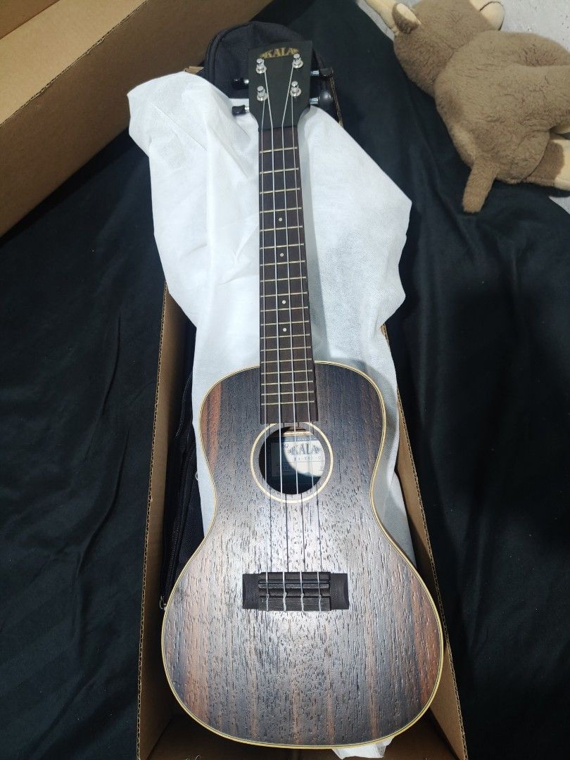 Kala Ukulele (Category: Musical Instruments) located in San Mateo. Submitted by ivowaps (Listing ID 1462880234, Image 1). Description: - Kala Ukulele (Model Ka-Eby-C) - Features Super Nylgut strings for great sound - Equipped with Nubone nut and saddle for enhanced tone and sustain - Comes with a convenient gig bag - Suitable for both beginners and experienced players - Gently used, tuned a few times to settle strings .
