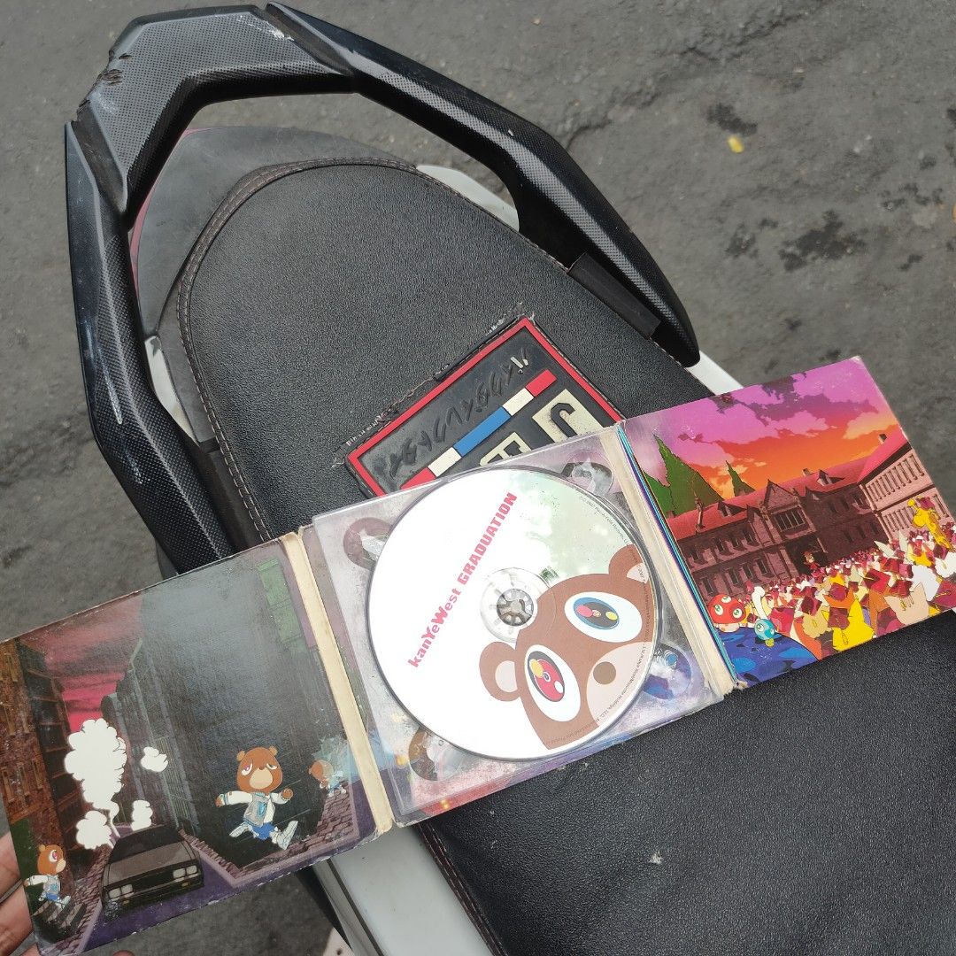 Kanye West Graduation CD Album (Category: CDs & DVDs) located in Taguig. Submitted by actualizeboutique (Listing ID 1462771918, Image 2). Description: - Kanye West Graduation CD - Includes the hit song 'Stronger' - Essential album for hip-hop enthusiasts.