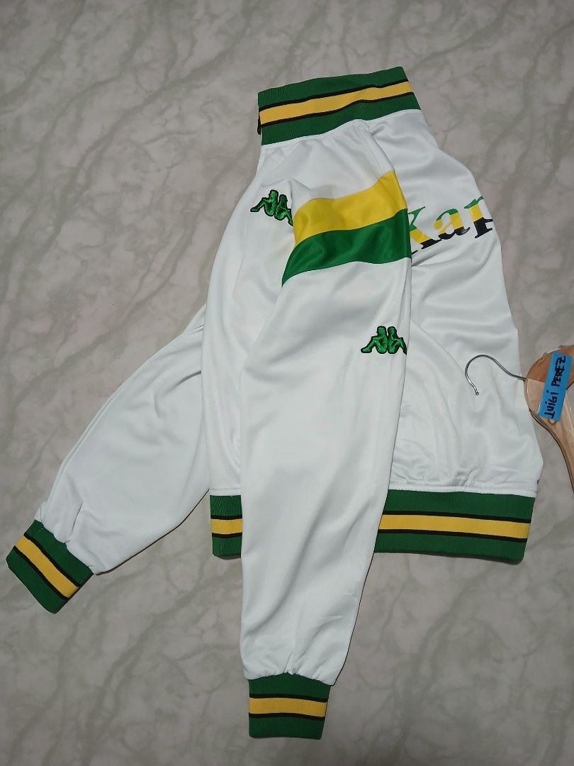 Kappa White Green Yellow Track Jacket Size Large (Category: Coats, Jackets and Outerwear) located in Plaridel. Submitted by igieperez147282 (Listing ID 1462843293, Image 3). Description: - White Kappa track jacket - Green and yellow accent details - Kappa logo on chest and back - Ribbed collar, cuffs, and hem - Full zip closure - Ideal for casual wear or sports.
