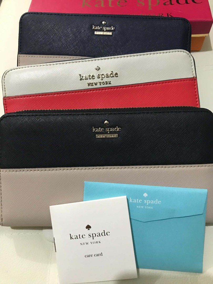 Kate Spade Long Wallet - Multiple Colors Available (Category: Wallets & Card holders) located in Manila. Submitted by hearthearty (Listing ID 1462838660, Image 2). Description: Pm for individual pricing - Genuine leather Kate Spade zip around wallets - Available colors: navy/beige, red/white/black, black/beige - Comes with care card and box (selected item) - Ideal for organizing your essentials.