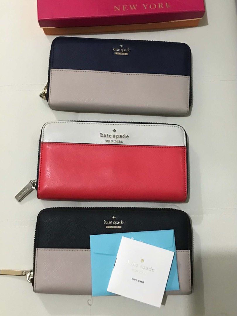 Kate Spade Long Wallet - Multiple Colors Available (Category: Wallets & Card holders) located in Manila. Submitted by hearthearty (Listing ID 1462838660, Image 1). Description: Pm for individual pricing - Genuine leather Kate Spade zip around wallets - Available colors: navy/beige, red/white/black, black/beige - Comes with care card and box (selected item) - Ideal for organizing your essentials.