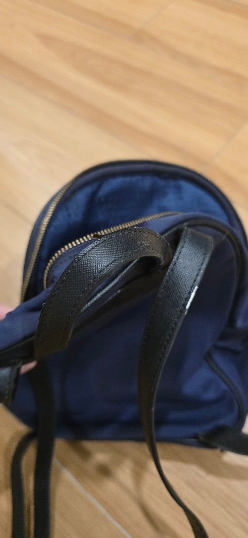 Kate Spade Navy Blue Nylon Backpack (Category: Backpacks) located in Quezon City. Submitted by qc_seller (Listing ID 1462828406, Image 2). Description: Original from Canada Navy blue Kate Spade Bradley Wilson Road Backpack French Navy Bluewith black leather trim and gold hardware. Adjustable straps. Some wear on leather, as shown. Zippers work well. Perfect for daily use. - Nylon Exterior with Leather Trim - Kate Spade Capital Jacquard Lining - A