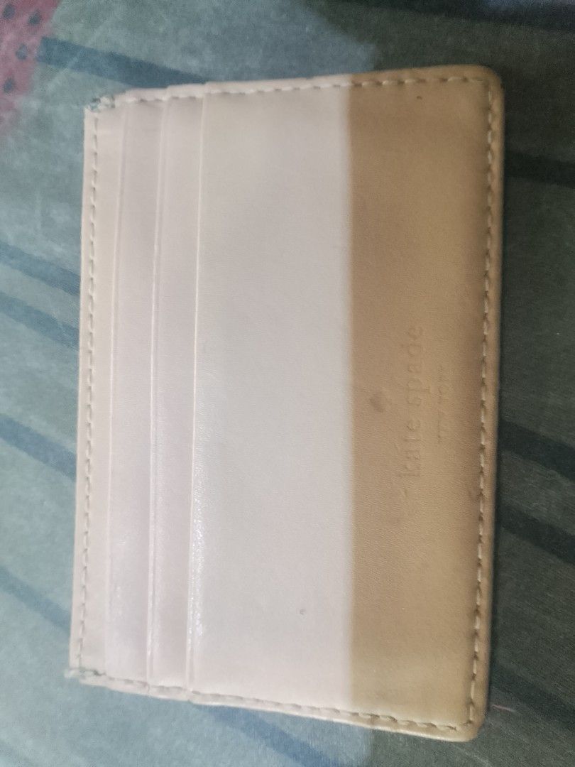 2k for lv and kate spade (Category: Wallets & Card holders) located in Cagayan de Oro. Submitted by brex7 (Listing ID 1462711001, Image 2). Description: - Authentic Red Kate Spade Card Holder - Genuine Leather - Features classic spade logo and New York detail - Light cream interior with multiple card slots - Interior shows some signs of use - Ideal for keeping cards organized.