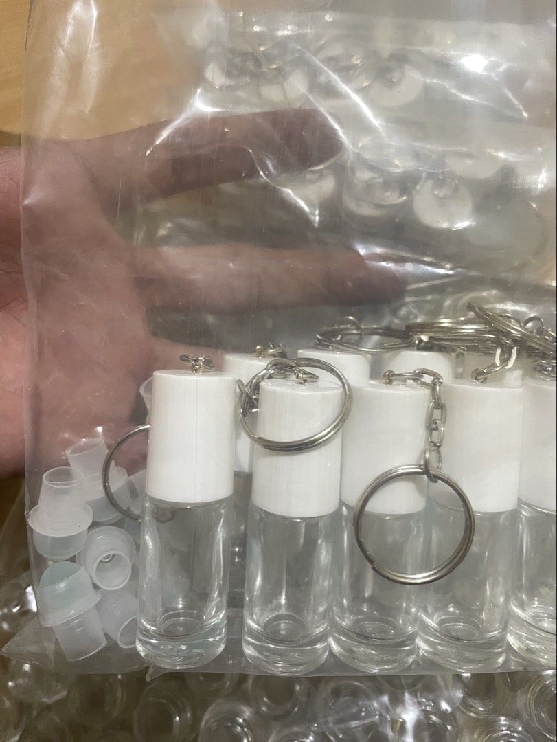 Keychain Roller Bottles Bulk Essential Oil Roller Bottles with Keychains and Caps (Category: Medical Supplies & Tools) located in Infanta. Submitted by frandez (Listing ID 1462762359, Image 2). Description: - Bundle of small glass roller bottles - Comes with white caps and attached keychains - Includes extra clear plastic caps - Ideal for DIY essential oil blends and perfumes - Plenty of bottles for your projects 125 pieces.