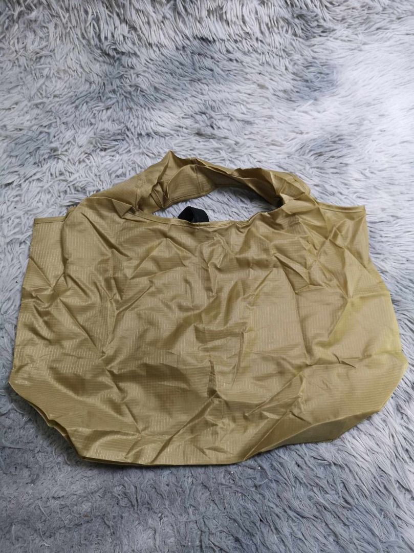 Khaki Nylon Durable Shopper Bag (Category: Tote Bags) located in Santa Cruz. Submitted by jmy_surplus.2 (Listing ID 1462701007, Image 1). Description: Size ; L- 12..4 W - 19.6 Color ; Khaki Type ; Shopper Bag Brand ; No brand Material ; Nylon Style ; Large Capacity Durable Shopper Bag LR 129 JMY 5 Batch #222.