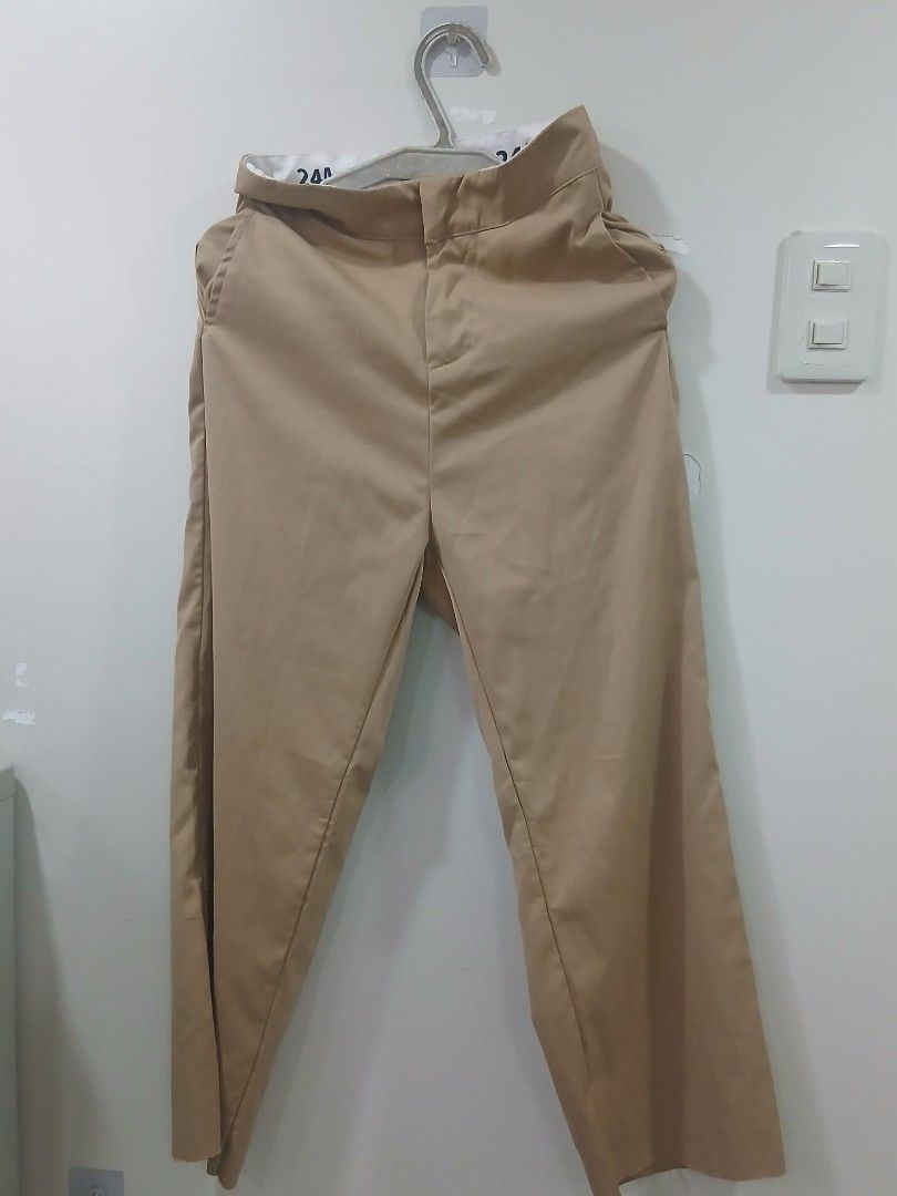 Khaki Pants (Category: Other Bottoms) located in Manila. Submitted by frances023 (Listing ID 1462807327, Image 1). Description: - Classic fit khaki pants - Distinctive white waistband with black lettering - Versatile for casual or work occasions - Gently used and ready for a new owner.