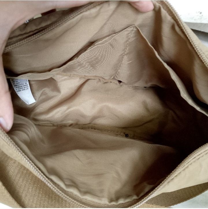 Khaki Uniqlo dumpling bag from taiwan (Category: Cross-body Bags) located in Binan City. Submitted by godgiven117 (Listing ID 1462766637, Image 2). Description: ‎⚠️ FOR SURE BUYERS ONLY ‎ ‎Please read the listing carefully before messaging. All available photos, condition details, and item information have already been posted. ‎ ‎❌ No additional photos, videos, measurements, or item details will be provided. ‎❌ No inquiries from unsure buyers, ca