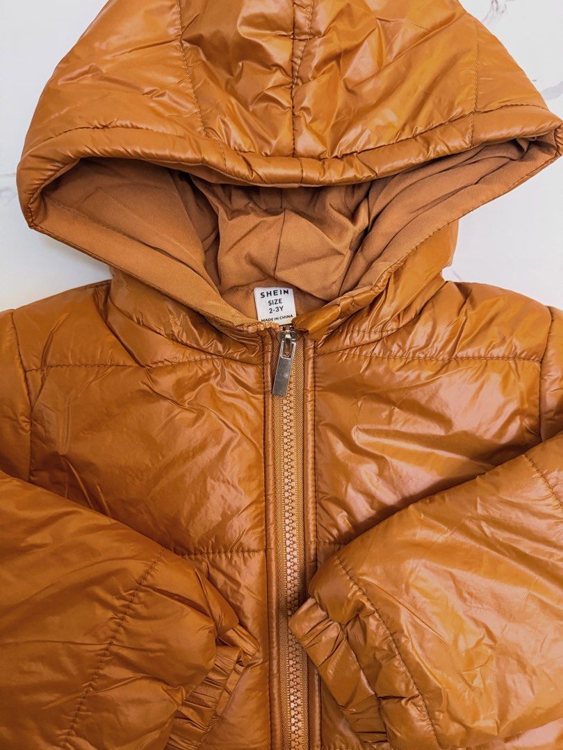 Kids Brown Puffer Jacket 12-18 Months (Category: Babies & Kids Fashion) located in Angeles City. Submitted by momandmini9 (Listing ID 1462730146, Image 2). Description: Cute brown hooded puffer jacket for babies 12-18 months. Zipper front, elastic cuffs. Warm and perfect for cold weather. Used once. Excellent condition .