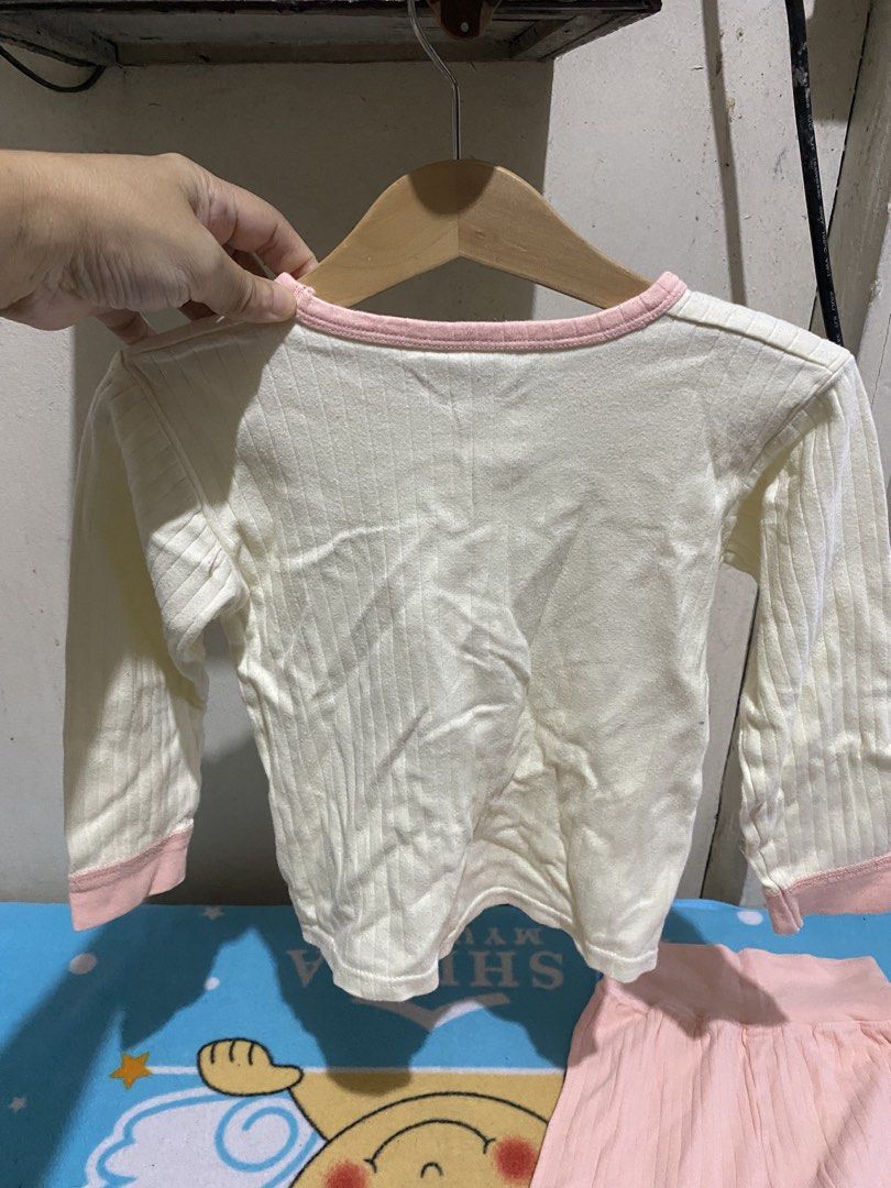 Kids Unicorn Pajama Set Size 110 (Category: Babies & Kids Fashion) located in Manila. Submitted by resi.diaz (Listing ID 1462847481, Image 3). Description: - Adorable long-sleeved pajama set for kids. - Cream top with a charming unicorn graphic and pink trim. - Comfortable pink ribbed pants. - Size: 110 (fits most 4-5 year olds, please check measurements). - Ideal for cozy nights and sweet dreams..