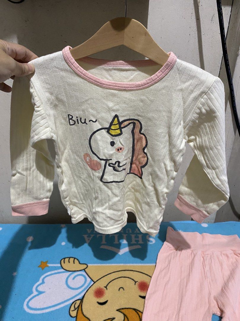 Kids Unicorn Pajama Set Size 110 (Category: Babies & Kids Fashion) located in Manila. Submitted by resi.diaz (Listing ID 1462847481, Image 2). Description: - Adorable long-sleeved pajama set for kids. - Cream top with a charming unicorn graphic and pink trim. - Comfortable pink ribbed pants. - Size: 110 (fits most 4-5 year olds, please check measurements). - Ideal for cozy nights and sweet dreams..