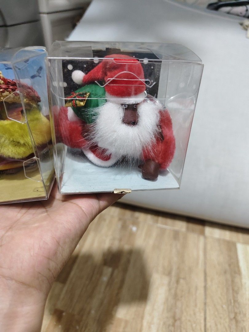 Kipling Bag Charm or Keychain (Category: Other Home Decor) located in Makati City. Submitted by abegailbrezuela (Listing ID 1462783259, Image 3). Description: - Set of 2 Kipling Bag Charm or Keychain - Includes classic Santa Claus with gift sack - Includes fun character with straw hat and yellow scarf - Both Bag Charm or Keychain are in their original clear plastic boxes - Makes a great festive gift - 850 each.