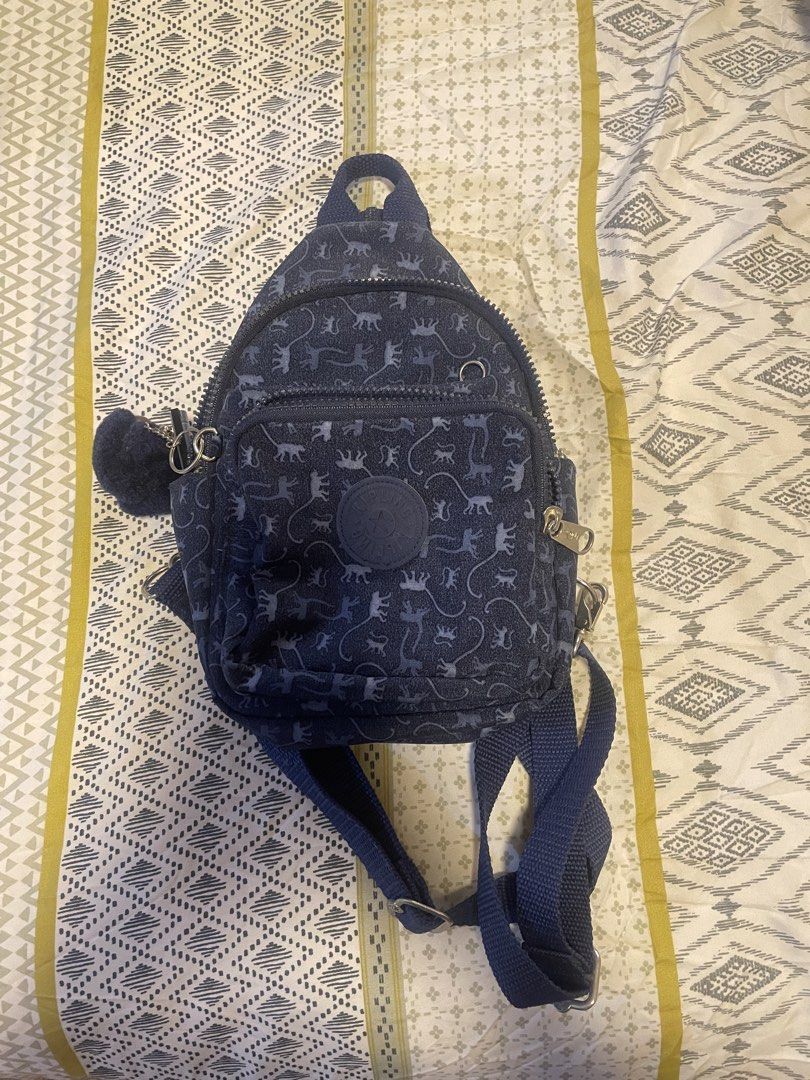 Kipling Mini Convertible Backpack (Category: Backpacks) located in San Jose. Submitted by vvcarmen (Listing ID 1462768055, Image 2). Description: Hindi na nagagamit 2x lang nagamit during travel good as new. Bought this at the mall brand new for ₱4,000 Selling price ₱2,500 (free shipping) Very steal super like new pa ‘to - Super Cute Kipling mini backpack - Dark blue with fun dinosaur print - Includes classic Kipling monkey charm - Adjustable str