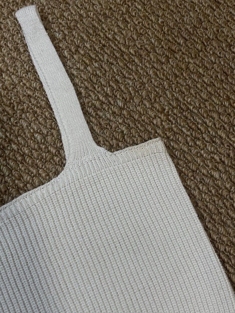 Knit Tank Top (cream) (Category: Sleeveless) located in Pasig City. Submitted by miafml-closet-cleanout (Listing ID 1462771357, Image 2). Description: - i used to wear this top SO MUCH haha - super nice fabric! doesn't hug your bilbil hehe - flaw/s: yellowish discoloration sa underarm part posted price is fixed ♡ will not respond to hagglers. 💵 mop: gcash / bdo / maribank / unionbank 🛵 courier: any as long as arranged by buyer 🙅🏻‍♀️ no reques
