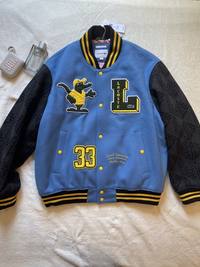 Lacoste Teddy Varsity Jacket XL Unisex (Category: Coats, Jackets and Outerwear) located in Quezon City. Submitted by justinmark0207 (Listing ID 1462814205, Image 1). Description: - Authentic Lacoste varsity jacket - Color: Blue body with black sleeves - Features: Patches and embroidery - Style: Ribbed cuffs and hem - Size: Unisex XL - Condition: Brand new with original tags attached - Original Retail Price: $795.00 - Selling Price: 25,000 Pesos ☎