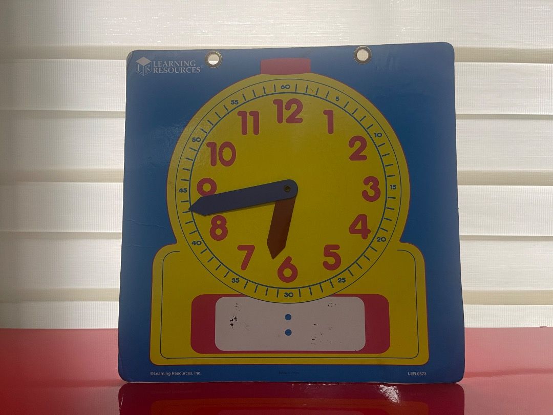 Learning Resources Teaching Time Clock (Category: Educational & Learning Toys) located in Marikina City. Submitted by bezz_bezzy (Listing ID 1462804313, Image 1). Description: - Helps kids learn to tell time - Features movable hands - Includes a space to write the time - Ideal for early learning - Suitable for home or classroom use - Brand: Learning Resources.