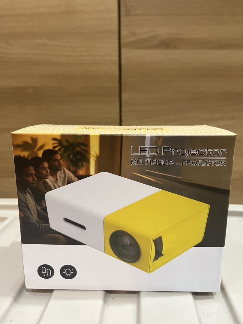LED Multimedia Projector - White & Yellow (Category: Projectors) located in Manila. Submitted by jericho_chan (Listing ID 1462725813, Image 1). Description: - Compact LED projector for multimedia - Stylish white and yellow design - Simple setup and user-friendly operation - Perfect for movie nights and presentations - Highly portable and convenient.