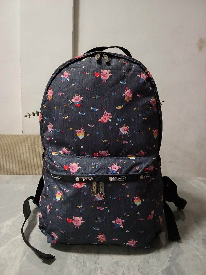 LeSportsac Backpack - Cute Pig Print (Category: Backpacks) located in Manila. Submitted by cosmiccloud-9236 (Listing ID 1462748009, Image 1). Description: - Fun backpack with all-over cute pig print - Dark grey base color - Two main zippered compartments - Additional zippered front pocket - Adjustable straps for comfortable wear - Durable material - Perfect for everyday use or travel.