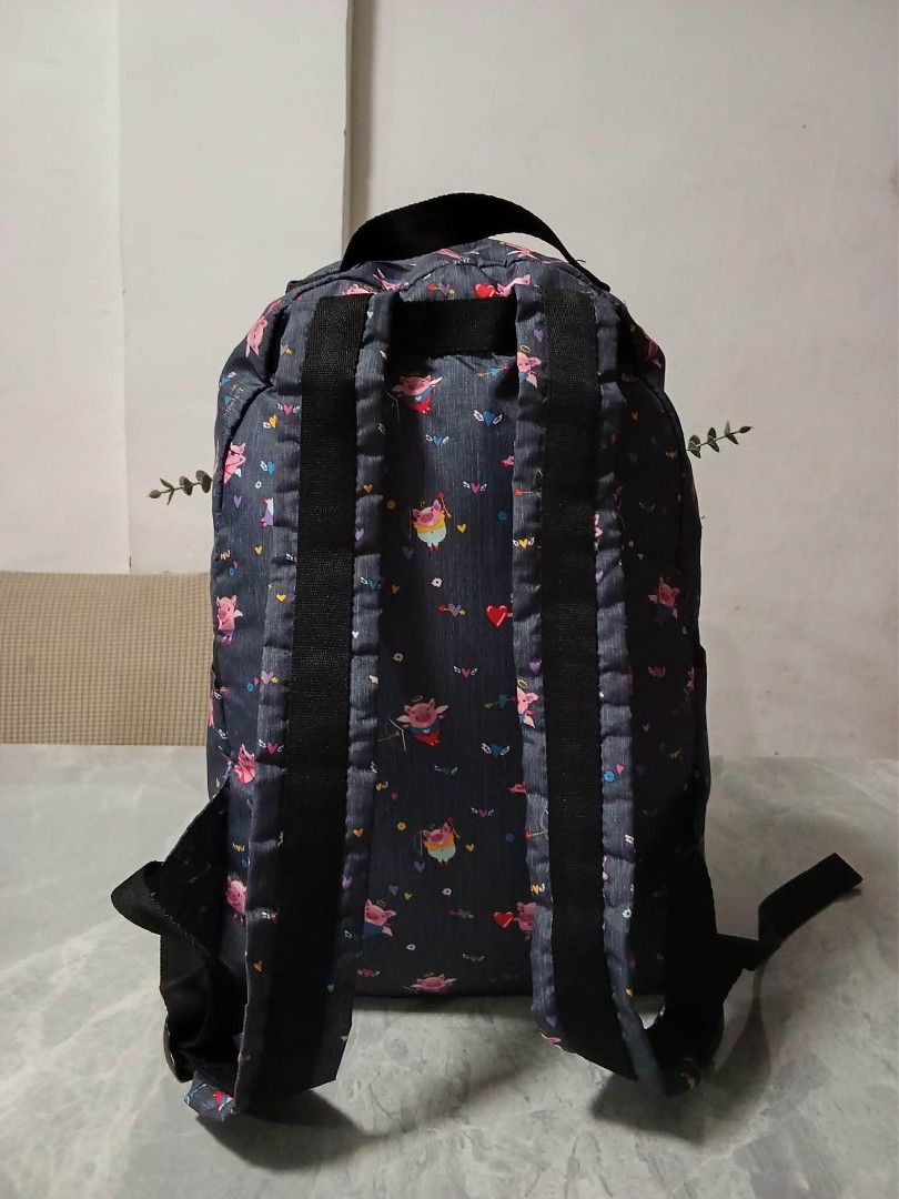 LeSportsac Backpack - Cute Pig Print (Category: Backpacks) located in Manila. Submitted by cosmiccloud-9236 (Listing ID 1462748009, Image 2). Description: - Fun backpack with all-over cute pig print - Dark grey base color - Two main zippered compartments - Additional zippered front pocket - Adjustable straps for comfortable wear - Durable material - Perfect for everyday use or travel.