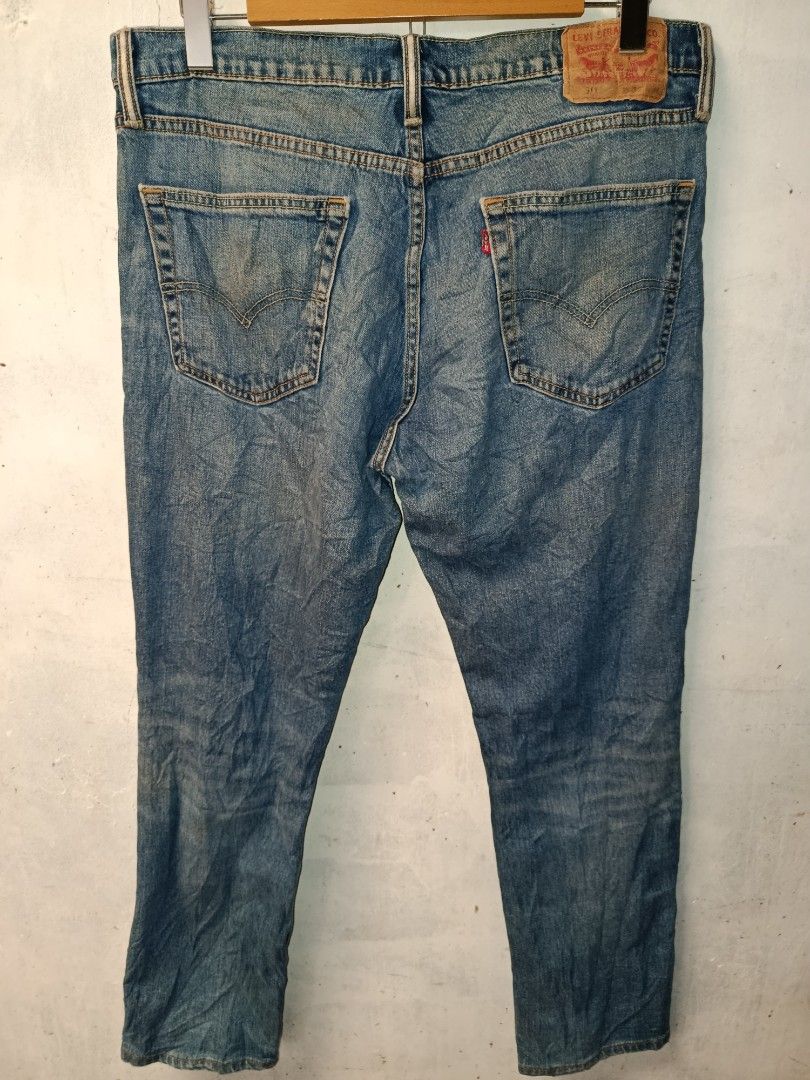 Levi's 511 Slim Fit Jeans (Category: Jeans) located in Nabunturan. Submitted by marmitoren42236 (Listing ID 1462692370, Image 1). Description: - Classic blue Levi's 511 jeans - Slim fit style - Vintage look with signs of wear - Button fly closure - Two front pockets and two back pockets - Perfect for casual outfits.