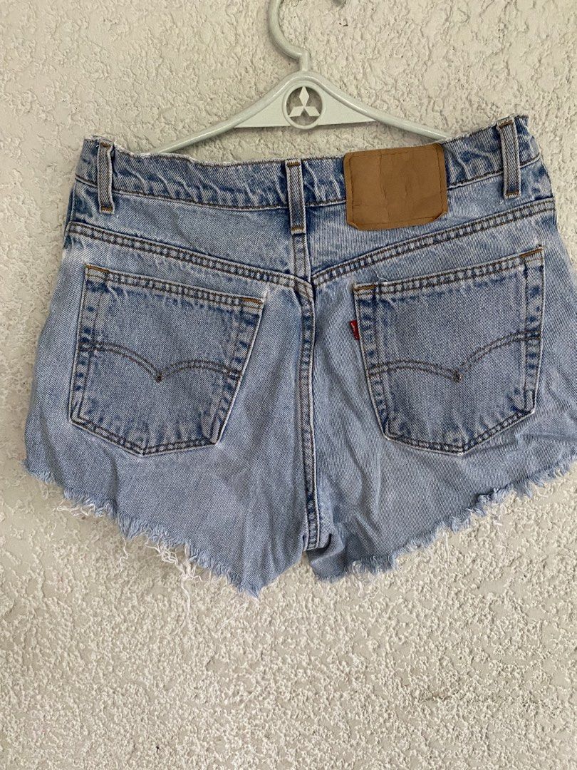Levi's Light Wash Denim Cutoff Shorts (Category: Shorts) located in Paranaque City. Submitted by dessells_ (Listing ID 1462759012, Image 2). Description: - Classic light wash Levi's denim shorts - Frayed hem for a casual vibe - Button fly closure - Two back pockets with signature Levi's stitching - measurement laid flat- waist- 15 inches - please check photos for the shorts comdition - Gcash/ J&T - shipping from Paranaque.