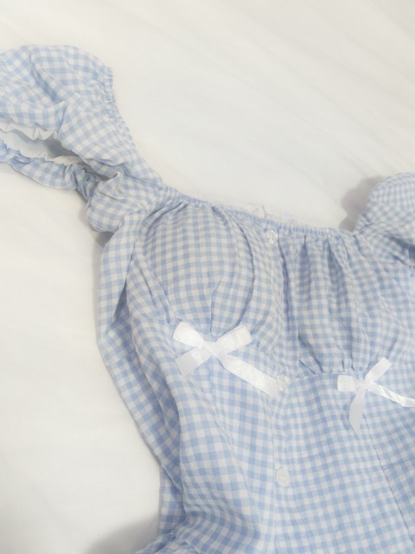 Light Blue Gingham Puff Sleeve Dress with Bows (Category: Dresses) located in Cebu City. Submitted by aetherealfinds (Listing ID 1462772250, Image 2). Description: Free with minimum 5 purchase at my shop - Adorable light blue gingham pattern - Features puff sleeves and a flattering sweetheart neckline - Sweet little white bows on the bust - Comfortable elasticated waist with a flowy, flared skirt - Ideal for picnics, casual outings, or a charming