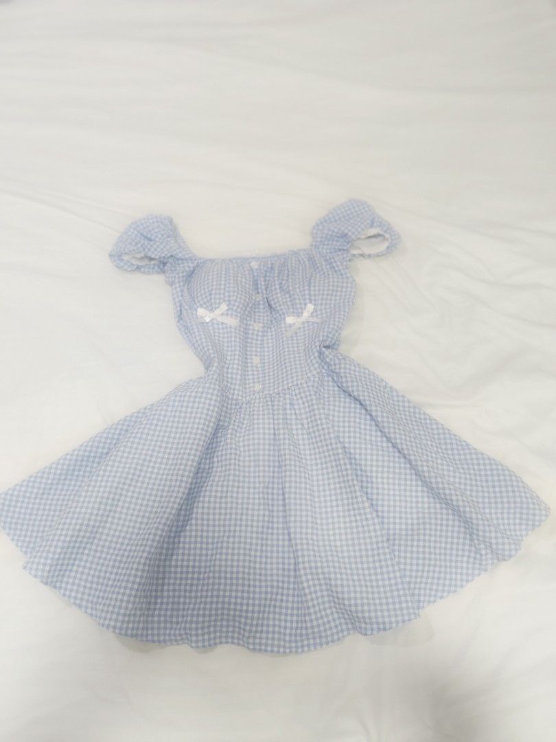 Light Blue Gingham Puff Sleeve Dress with Bows (Category: Dresses) located in Cebu City. Submitted by aetherealfinds (Listing ID 1462772250, Image 1). Description: Free with minimum 5 purchase at my shop - Adorable light blue gingham pattern - Features puff sleeves and a flattering sweetheart neckline - Sweet little white bows on the bust - Comfortable elasticated waist with a flowy, flared skirt - Ideal for picnics, casual outings, or a charming