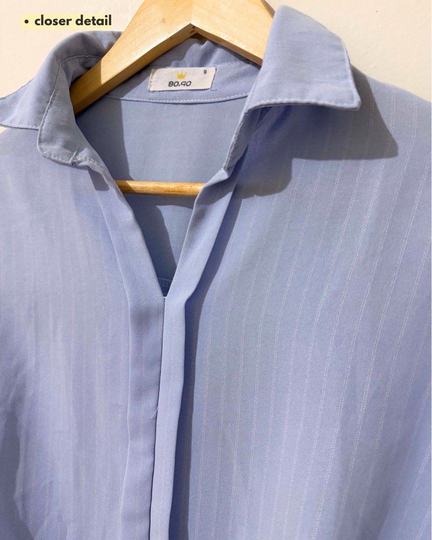 Light Blue Striped Twist Front Shirt (Category: Shirts) located in Subic. Submitted by ciesells (Listing ID 1462860924, Image 2). Description: bust: 46 (med-large) - Unique twist detail at the front hem - Cuffed short sleeves - Collar neckline with a V-split - Ideal for casual wear - Flowy fabric.
