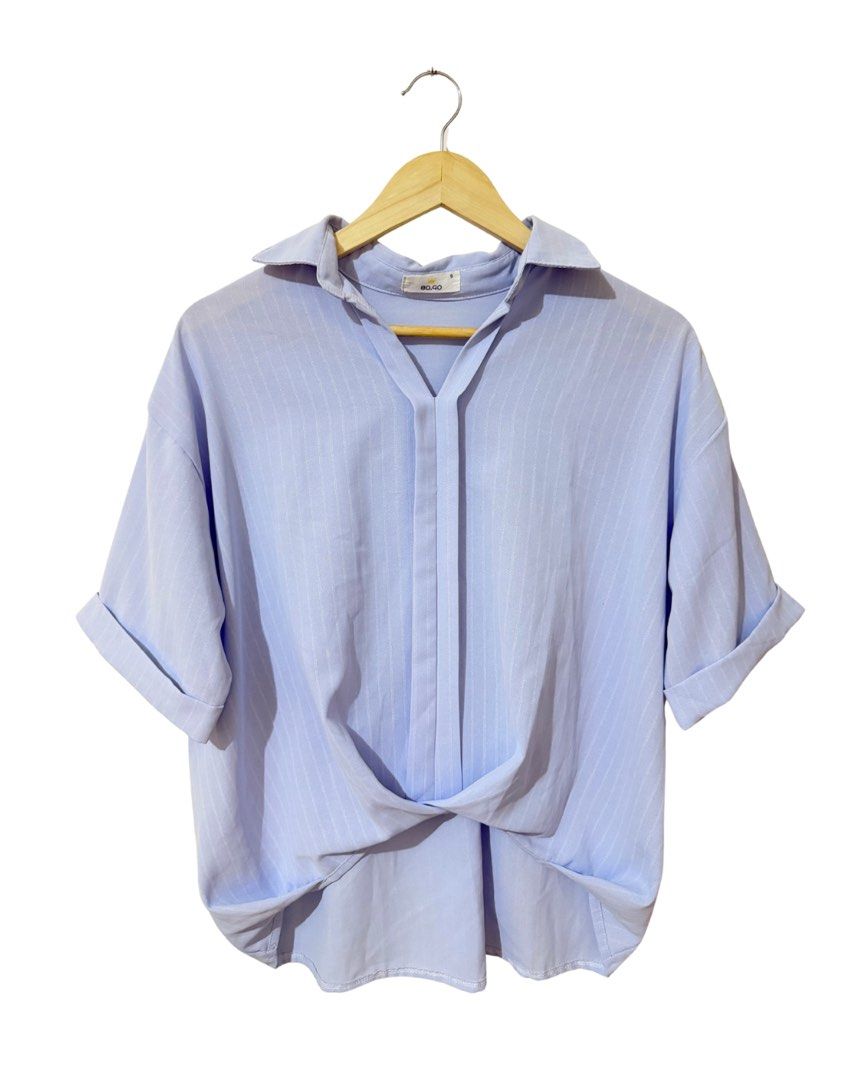 Light Blue Striped Twist Front Shirt (Category: Shirts) located in Subic. Submitted by ciesells (Listing ID 1462860924, Image 1). Description: bust: 46 (med-large) - Unique twist detail at the front hem - Cuffed short sleeves - Collar neckline with a V-split - Ideal for casual wear - Flowy fabric.