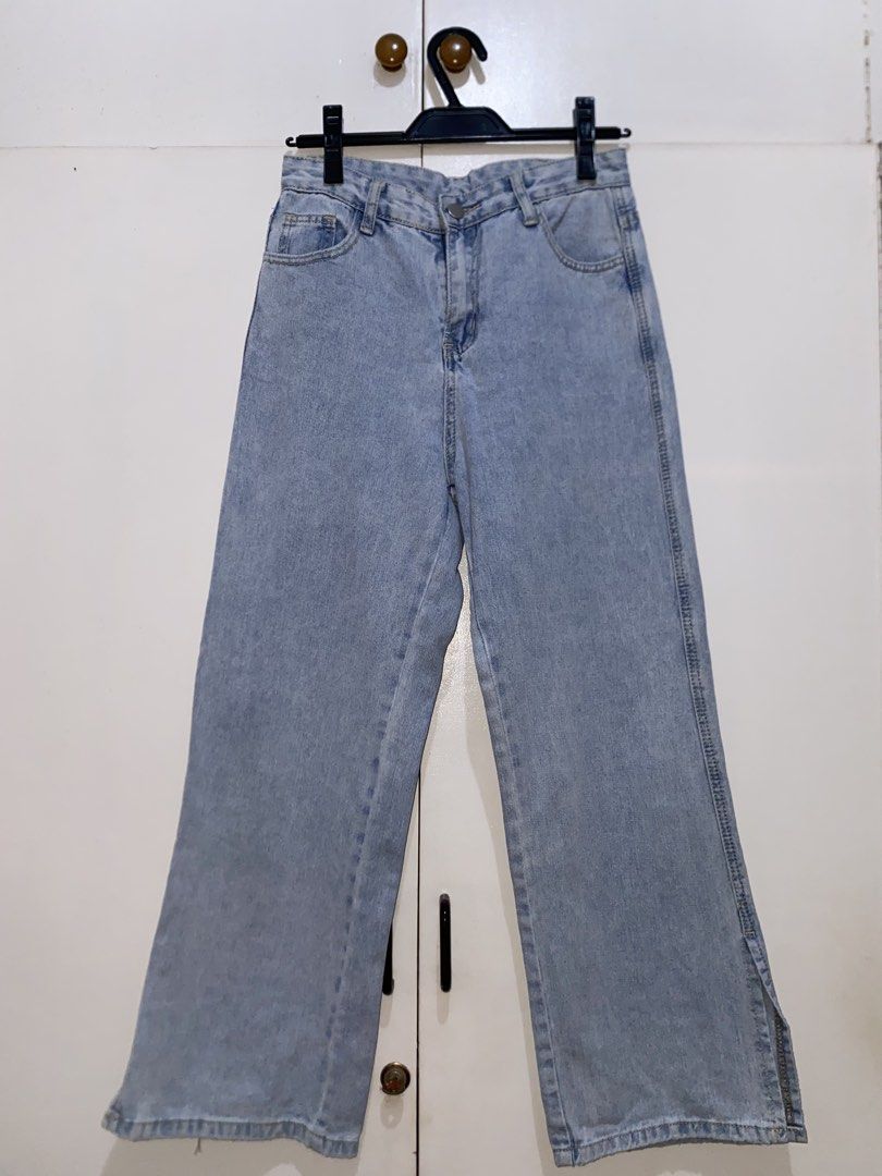 Light Wash Wide Leg Jeans with Side Slits (Category: Jeans) located in Quezon City. Submitted by addy_addy (Listing ID 1462820931, Image 1). Description: - Light wash denim - Wide leg cut with a slight flare - Side slits on each leg - Classic five-pocket styling - Button and zip fly closure - Ideal for casual outfits - Approximate measurements * Waistband: 27 inches * Length: 36.5 inches * Inseam: 25 inches * Front rise: 11 inches * Hips: 35.5 in